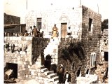 When upper rooms were added to the home a staircase was built outside. An early photograph.